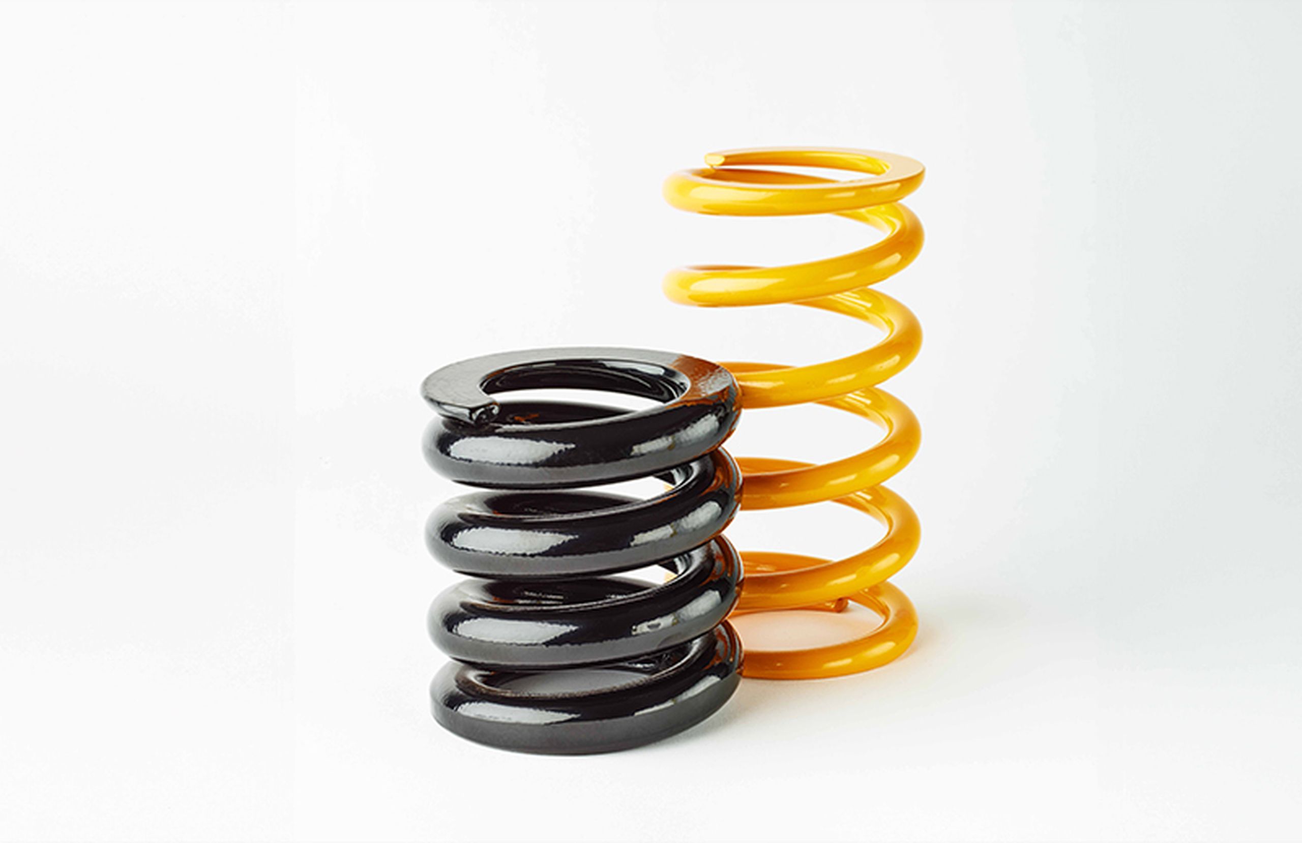 Pair of steel coil springs used in automotive suspension systems