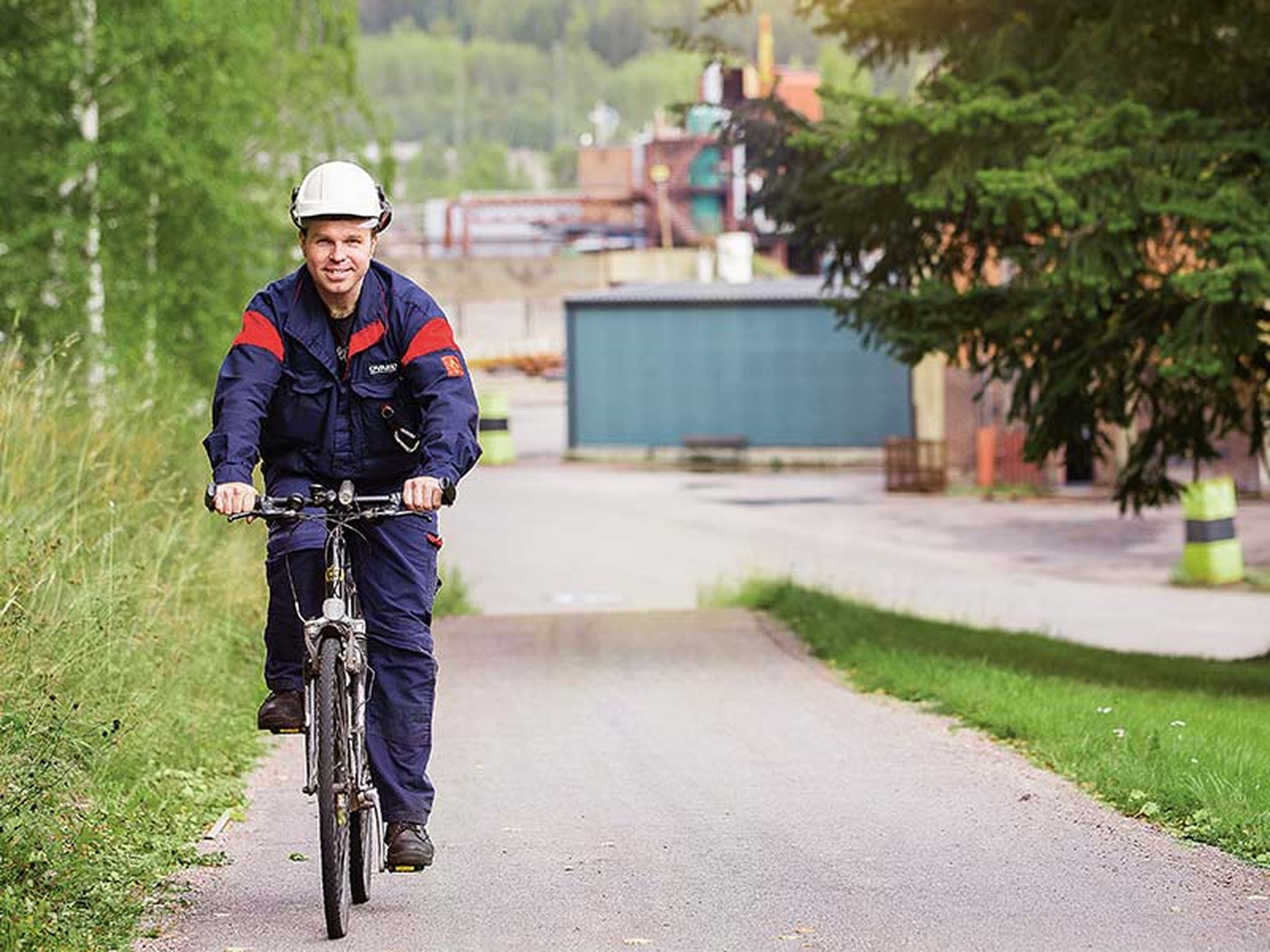 decorative image: Ovako employee on bicycle